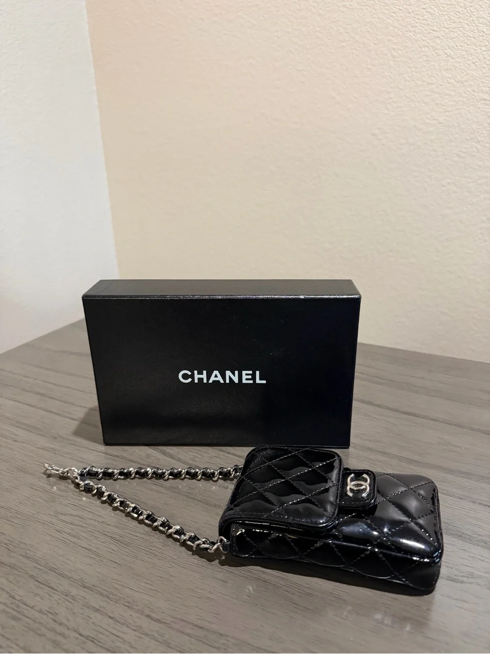 CHANEL Black Patent Leather Quilted Phone Case with Silver Hardware
